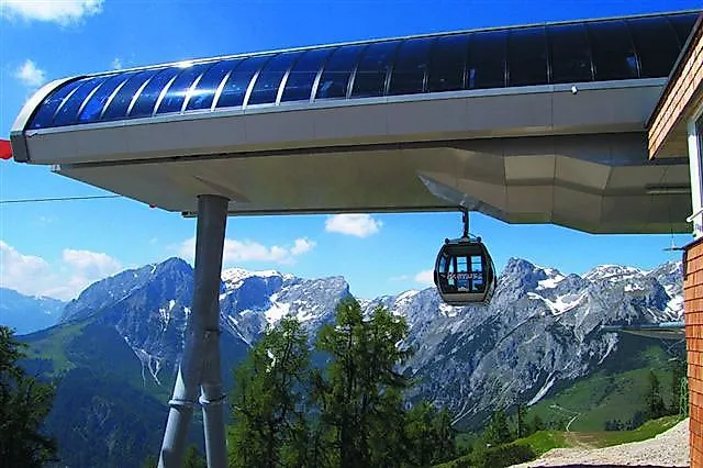 Gondola lift with a view of snow-covered peaks in Werfenweng