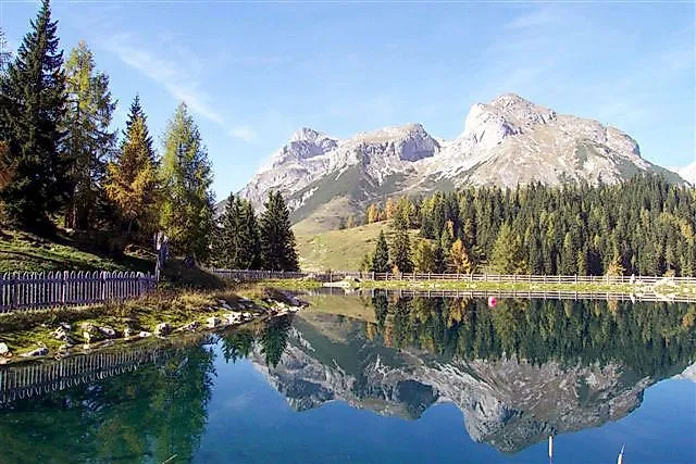 Mountain lake with reflection and Alpine panorama in Werfenweng in summer
